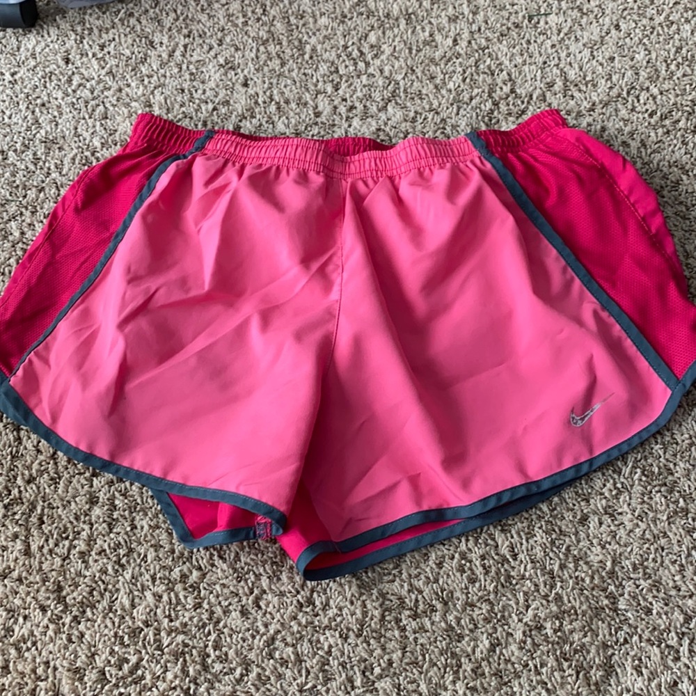 Pink Nike track shorts